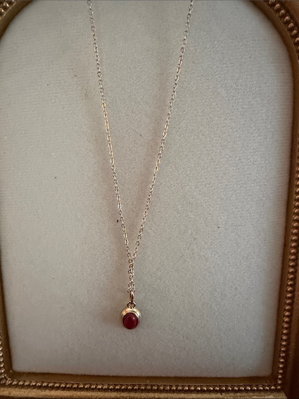 Gold Toned Necklace with Red Stone Pendant